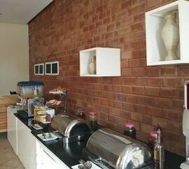 Cost effective, environmentally friendly walling Material Interlocking Stabilized Compressed Earth Bricks